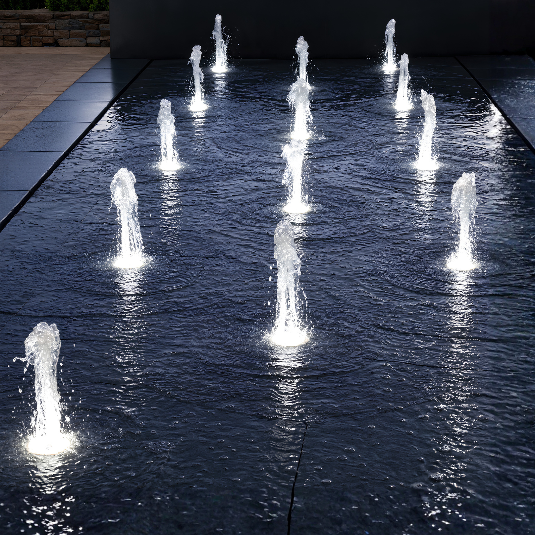 12mm stainless steel LED deck jet with 18W white 12V light and foam fountain nozzle for flush-mounted water features and fountains