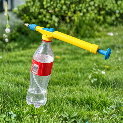 Bottle Pump Spray Gun with adjustable copper nozzle and manual pump-action pressure sprayer for watering plants, misting leaves and garden care. Reusable plastic bottle spray attachment designed for compatible 500ml and 2 Litre cold drink bottles, offering adjustable fine mist and larger water droplet spray settings.