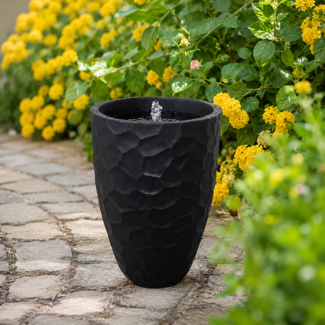Molten Stone contemporary outdoor water feature for gardens, patios, courtyards and landscaped spaces