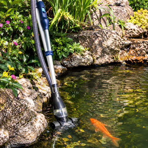 PC-1 Pond Vacuum Cleaner with 250W motor, 6000L/h flow rate, 2m telescopic pole, 6m discharge hose, remote control and two cleaning attachments for removing sludge and debris from garden and fish ponds.