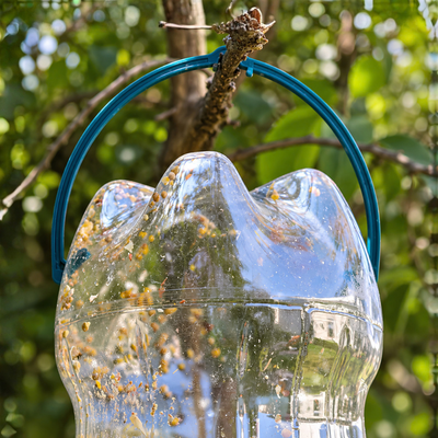 Recycled PVC bird feeder attachment for converting a 2L plastic bottle into a hanging DIY garden bird seed feeder