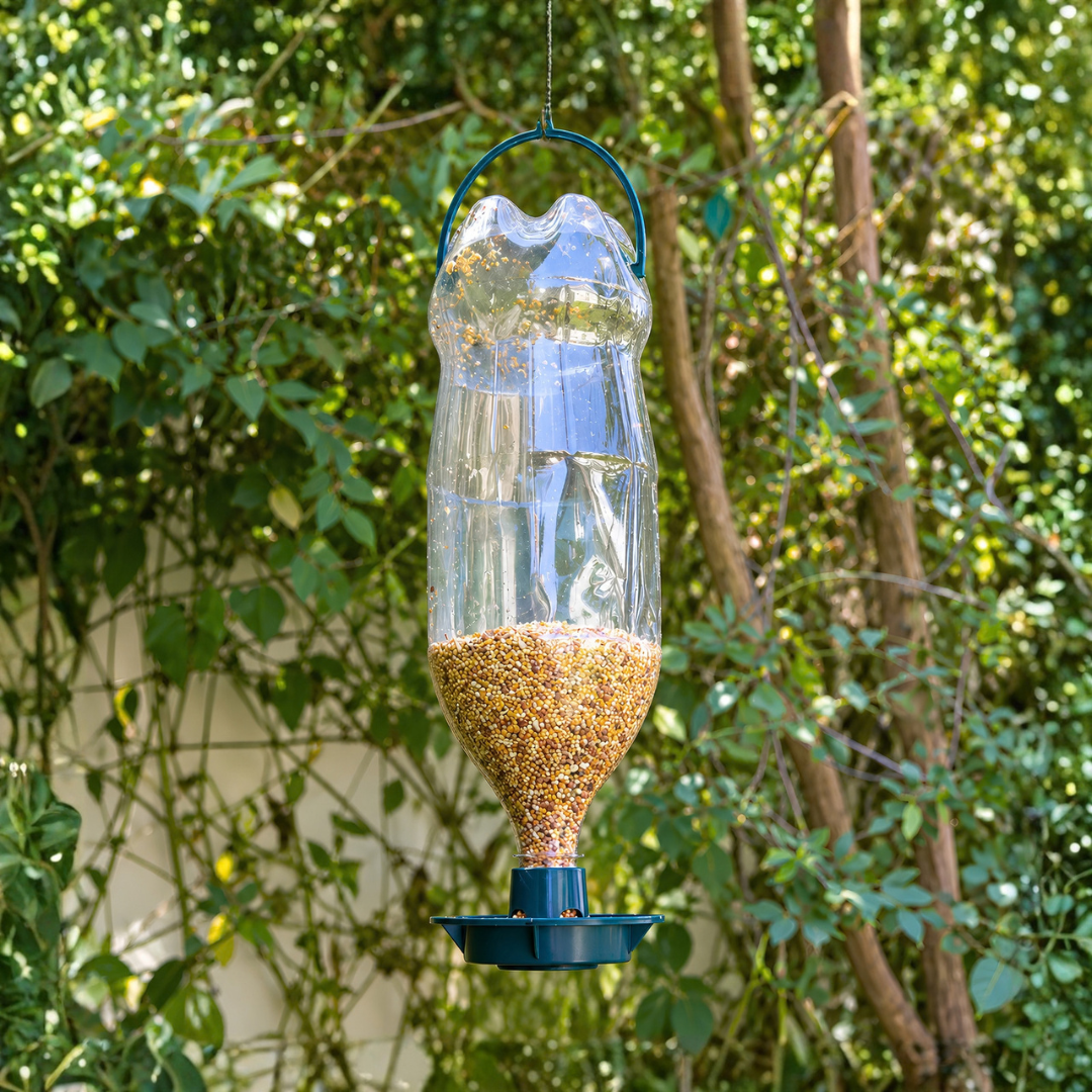 Recycled PVC bird feeder attachment for converting a 2L plastic bottle into a hanging DIY garden bird seed feeder