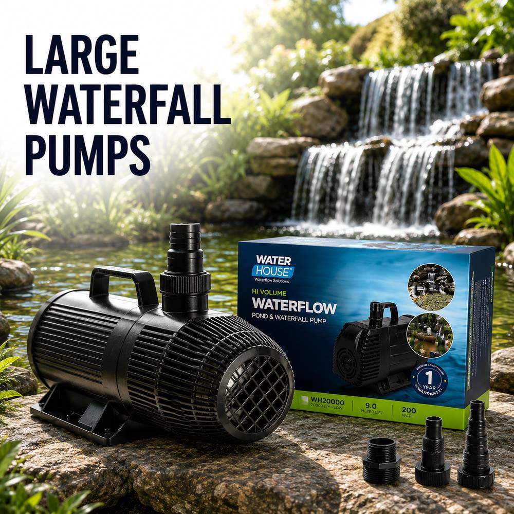 A black Water House waterfall pump shown beside its retail box and three connector fittings, set outdoors on a rock in front of a waterfall pond. Large text on the left reads 'LARGE WATERFALL PUMPS.