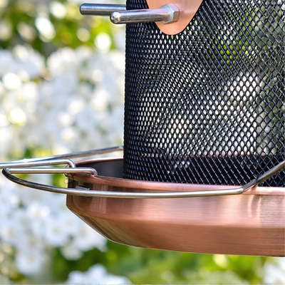 Waterhouse rose gold copper hanging bird feeder with protective roof and wire mesh feeding area for attracting garden birds