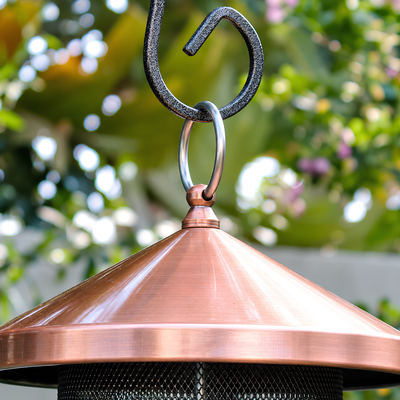 Waterhouse rose gold copper hanging bird feeder with protective roof and wire mesh feeding area for attracting garden birds