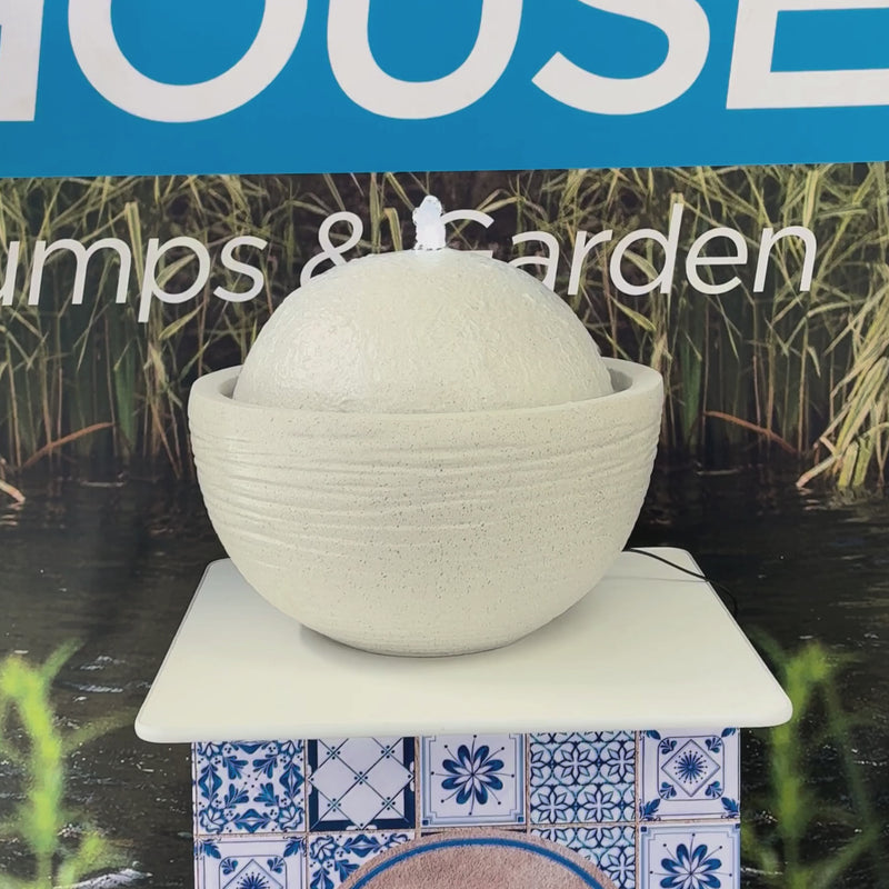 Round Bowl Water Feature with textured sphere and white stone-look finish for gardens, patios and courtyards