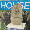Floral wall mounted water feature with flower and dragonfly design, stone-look finish and rounded basin for indoor or outdoor use